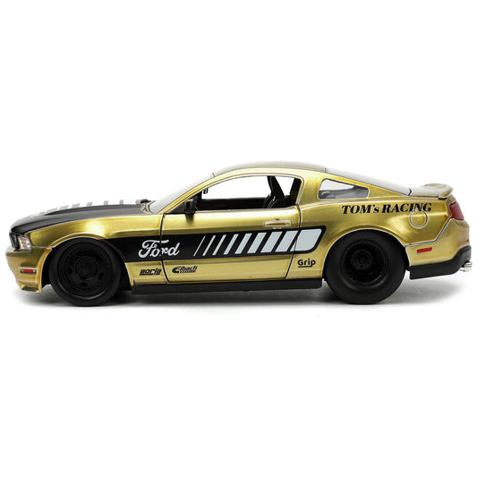 2010 Ford Mustang GT Gold Metallic with Black Graphics and Hood "Tom's Racing" "Bigtime Muscle" Series 1/24 Diecast Model Car by Jada