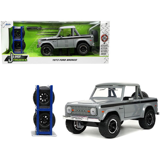 1973 Ford Bronco Pickup Truck Gray with Black Stripes with Extra Wheels "Just Trucks" Series 1/24 Diecast Model Car by Jada