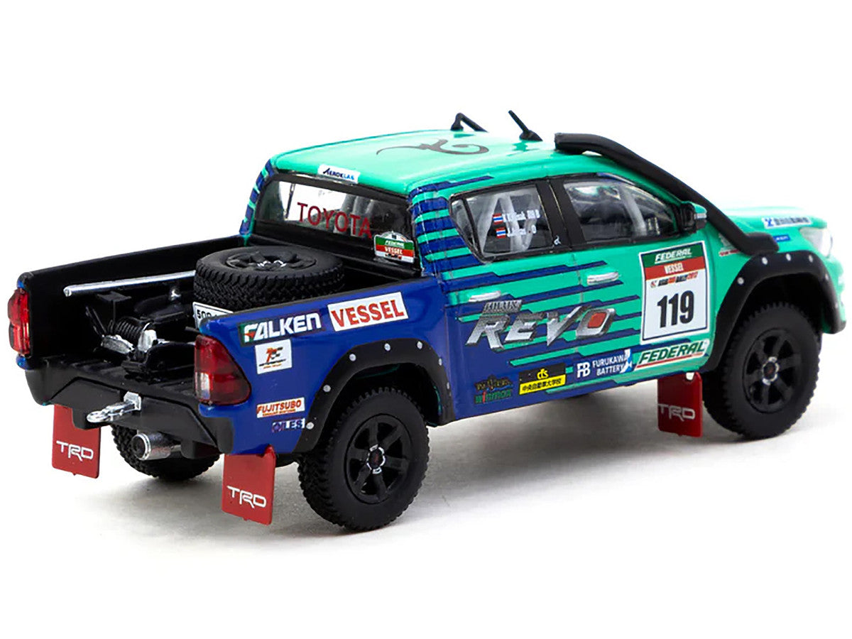 2017 Toyota Hilux AXCR Pickup Truck RHD (Right Hand Drive) #119 Green and Blue "Falken" Livery with Plastic Transporter Packaging "Falken Tires" 1/64 Diecast Model Car by Tarmac Works